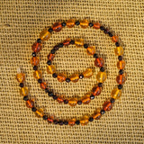 Unique Baltic Amber Necklace, 20" Long, Multi-color with Oval Faceted Beads