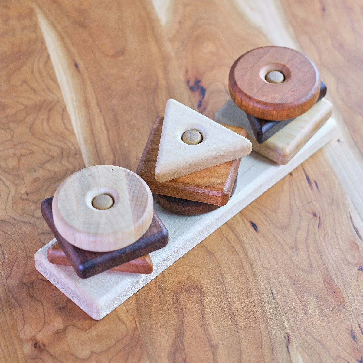 Trio Shape Stacker - 3 Woods, 3 Shapes Camden Rose Inc. / Palumba Trio Shape Stacker - 3 Woods, 3 Shapes Camden Rose Inc. / Palumba