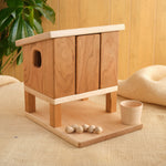 Wooden hen house with two doors, ramp steps, and small wooden balls on base