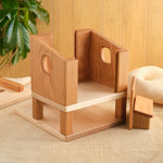 Wooden hen house with open front panels and stacked interior platforms