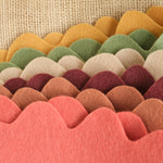 Set of 6 felt crowns with tan, orange, green, and red tones, scalloped top
