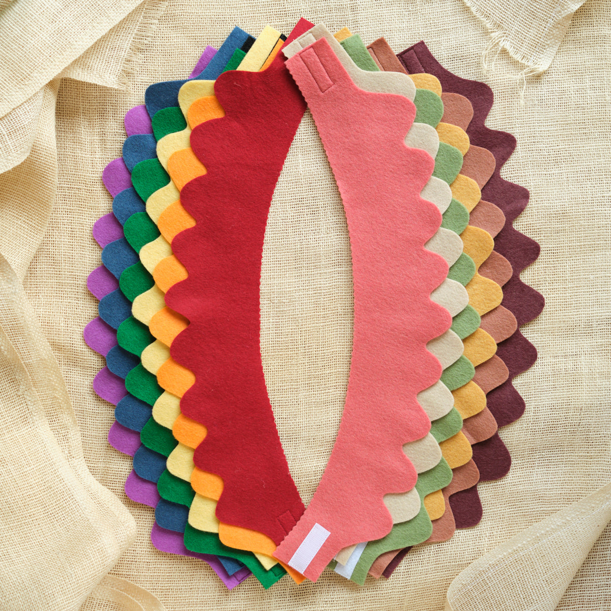 Set of 6 wool felt crowns, layered assortment in bright red, pink, purple, and green