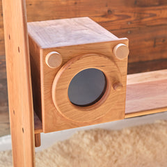 Wooden pretend washing machine with round door and two knob details, wood frame